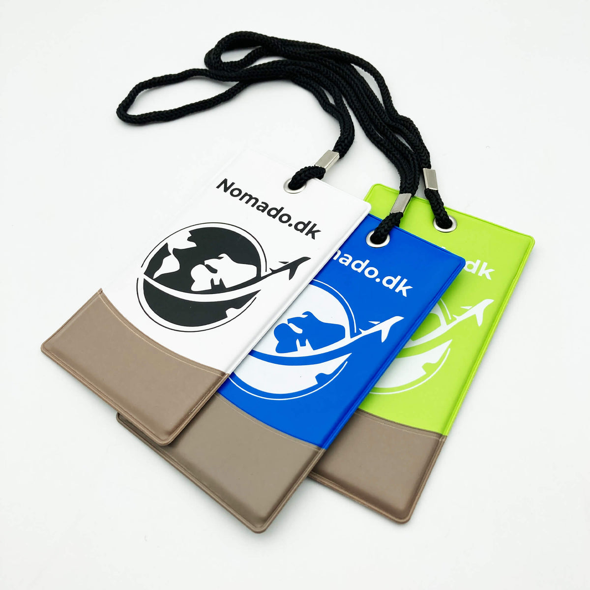 Nomado luggage tags in white, blue and green with a logo and cord for easy luggage identification